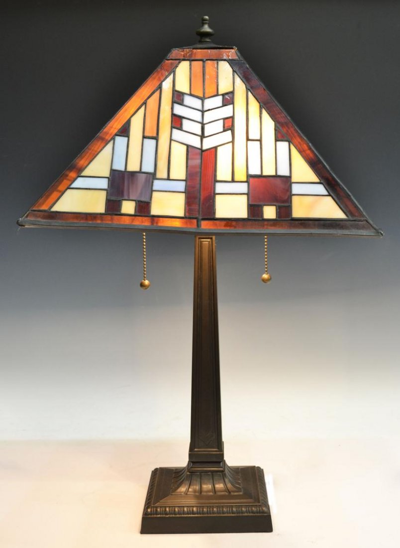 STAINED LEADED GLASS DESK LAMP: Metal desk or table lamp with arrow pattern leaded glass shade, late 20th c., cracks and restoration at top as pictured, overall: 24"h, 15"w, 15"d, 9.75lbs Start Price: $80.00