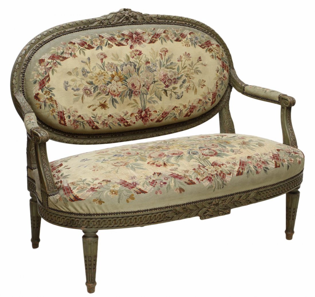 FINE FRENCH LOUIS XVI STYLE TAPESTRY CARVED SETTEE: French Louis XVI style settee, 19th c., the frame carved with berries, ribbon and further ornamentation, in green paint, padded back and seat in floral Aubusson style tapestry, rising on fluted suppor