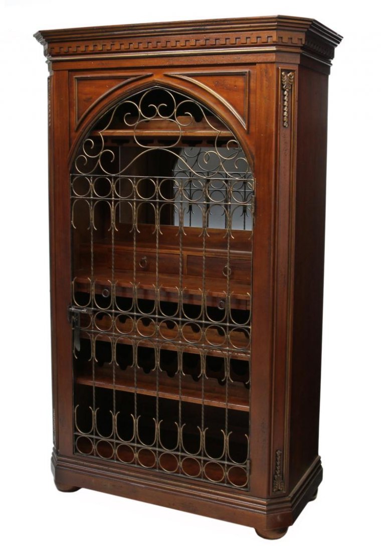 LARGE MAHOGANY & IRON WINE CABINET (74012B): A carved mahogany wine cabinet, the stepped cornice and dentil frieze above a single open door with open iron work, the mirrored interior completely fitted with hanging display for glasses, bottle rac