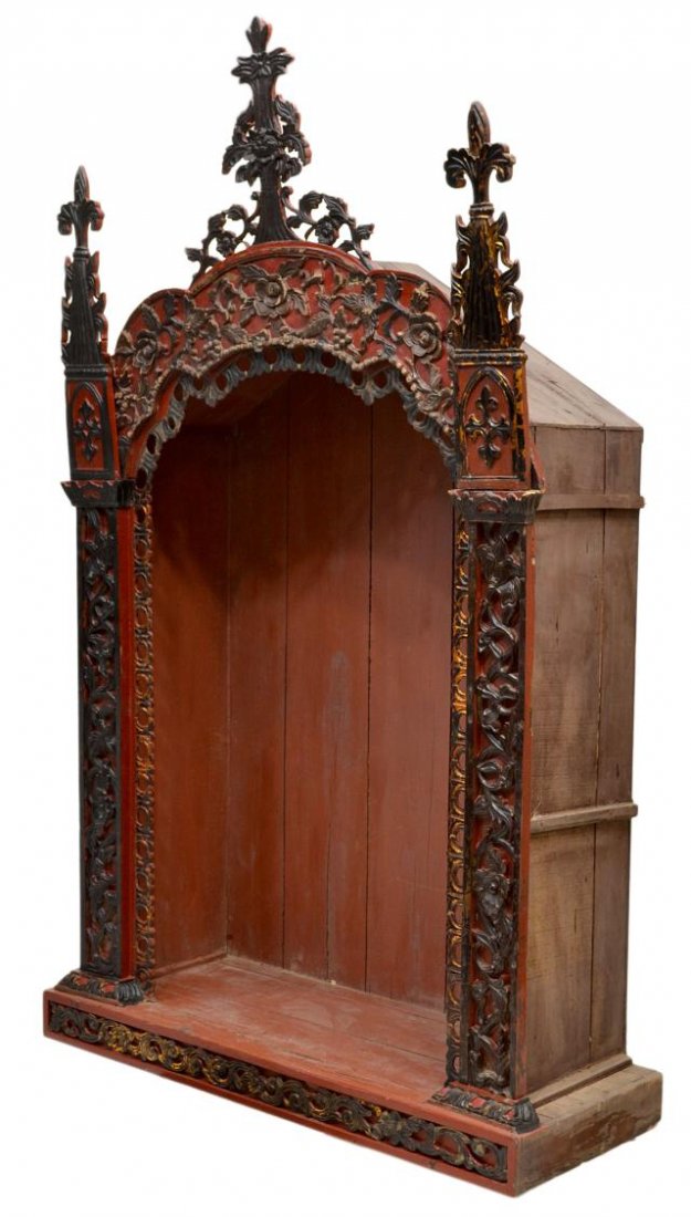LARGE ANTIQUE FRENCH COLONIAL CARVED ALTAR NICHE: Large French Colonial carved wood altar niche, 19th c., a cross surmounting the architectural case carved in the Gothic style, flanked by fleur-de-lis spires, detailed foliage and berry carvings to fa
