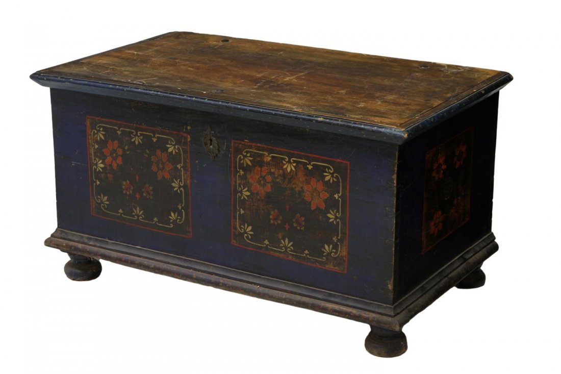 EASTERN EUROPE FLORAL PAINTED TRUNK: Large painted trunk, Eastern Europe, 19th. c., the front and sides with hand painted floral reserves on blue, a hinged top opening to the interior storage with a single door mounted box, set on bun fe