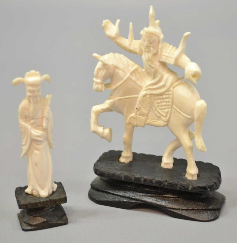 (2) CHINESE IVORY FIGURAL CARVINGS: *International shipping is not available on this lot* (lot of 2) Chinese ivory figural carvings: (1) figure mounted upon a horse, wood base, overall: 4.5"h, 3"w; (1) small robed figure, wood base, ove