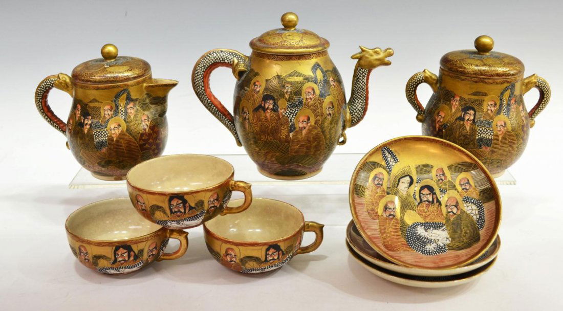 (9) JANPANESE GILDED STATSUMA DRAGON TEA SERVICE: (set of 9) Japanese Satsuma earthenware tea service having relief-molded dragon-form handles, extensively gilded and polychrome decorated with figures and dragons, comprising: (1) tea pot, 6.75"h; (1)