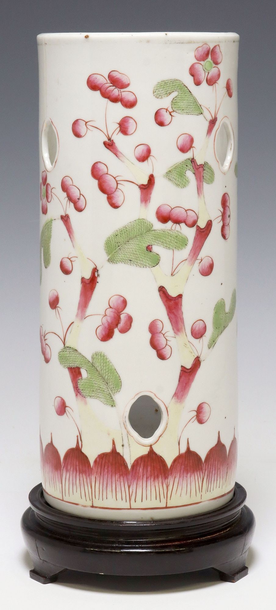 CHINESE FAMILLE ROSE PORCELAIN HAT STAND: Chinese porcelain hat stand, cylindrical form with lobed cut-outs, floral motifs, on wood base, hat stand: approx 11 3/8"h, 4.8"diam, overall: approx 12 7/8"h, 3lbs
