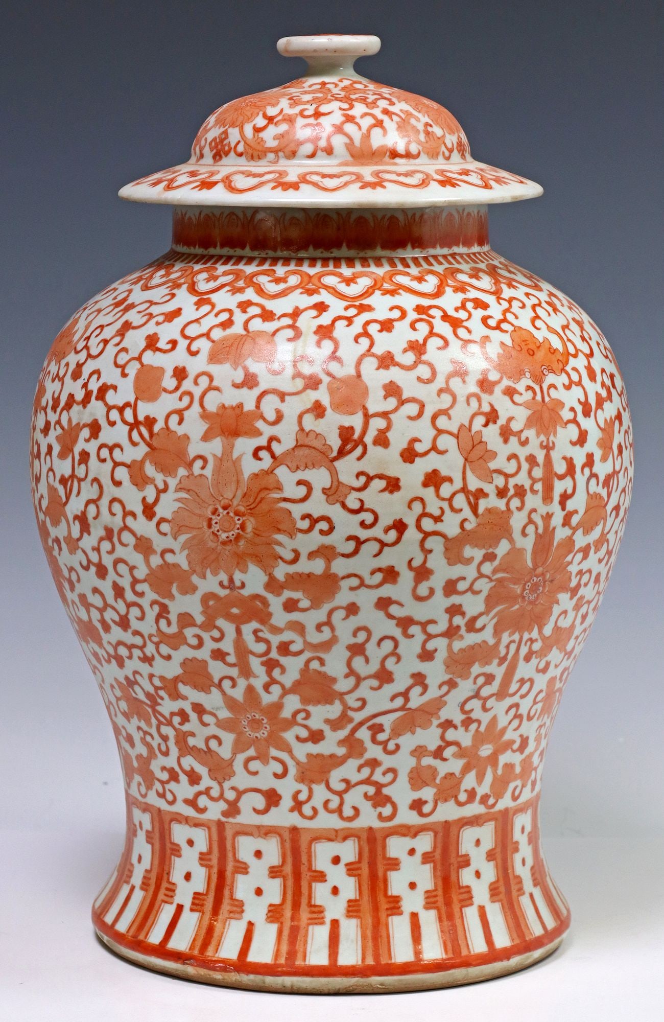 CHINESE IRON RED & WHITE PORCELAIN LIDDED TEMPLE JAR: Chinese porcelain covered temple jar, having iron red enameled lotus tracery and longevity motifs on white ground, approx 15.25"h, 10 3/8"diam, 9lbs