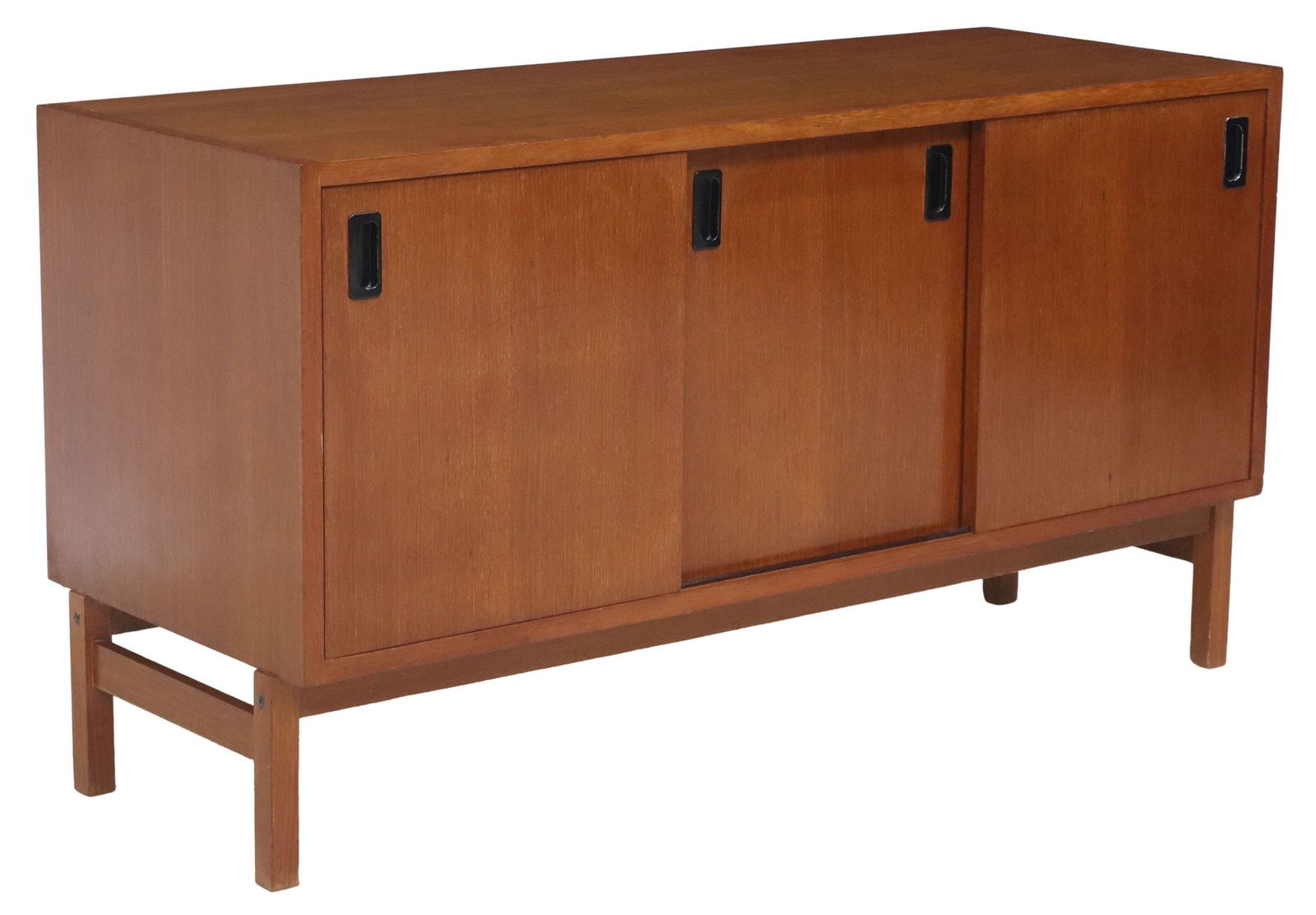 ITALIAN MID-CENTURY MODERN TEAK CABINET CREDENZA: Italian mid-century modern teak sideboard, c.1960s, three sliding cabinet doors, on stretcher-joined legs, rear leg intact with restoration, approx 26"h, 48"w, 17.75"d**NOTE: PART