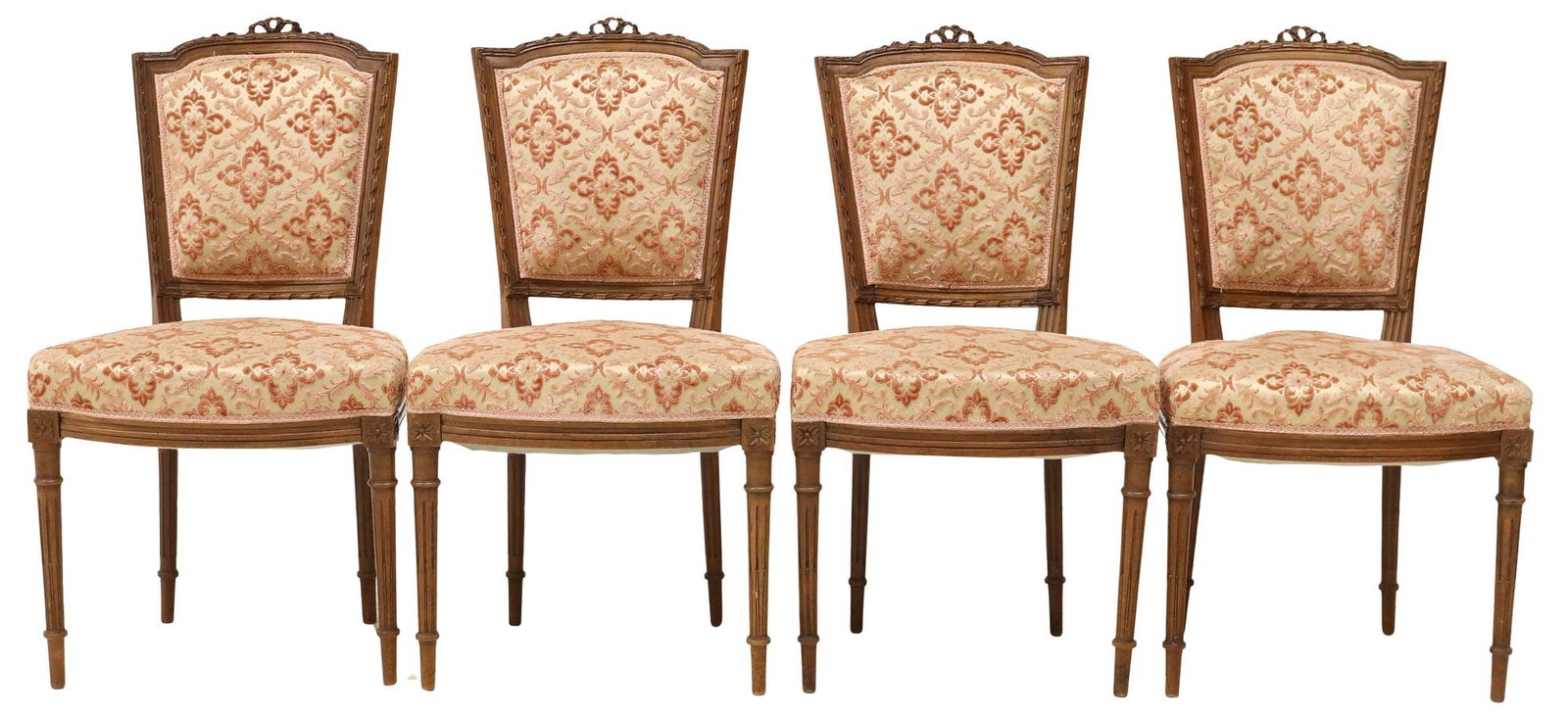 (4) FRENCH LOUIS XVI STYLE UPHOLSTERED SIDE CHAIRS: (lot of 4) French Louis XVI style chairs, early 20th c., having carved ribbon crest, over patterned fabric upholstery back and seat, ending on fluted and tapered legs, approx 33"h, 18 1