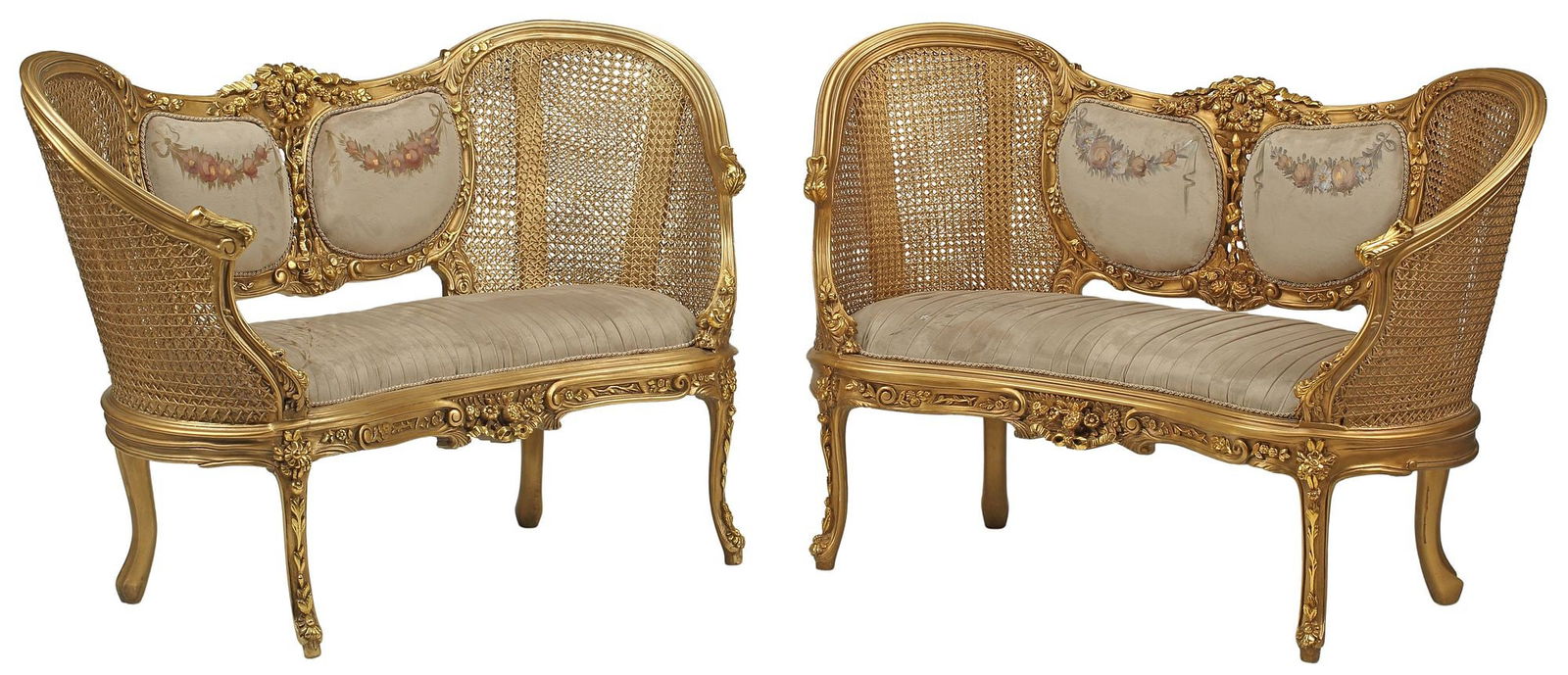 (2) LOUIS XV STYLE DOUBLE-CANED & UPHOLSTERED GILT SALON SETTEES: (pair) Louis XV style gilt salon settees/ sofas, each having floral ribbon crest, over padded back and seat in pleated gray velvet upholstery with painted foliates, double-caned sides, rising on