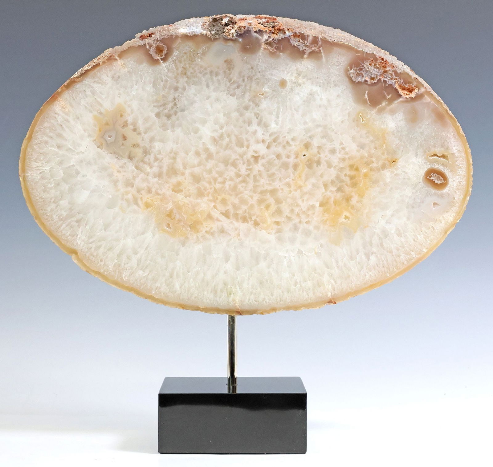 GEOLOGICAL OVULAR AGATE SLICE ON BLACK MARBLE BASE (1 of 3)