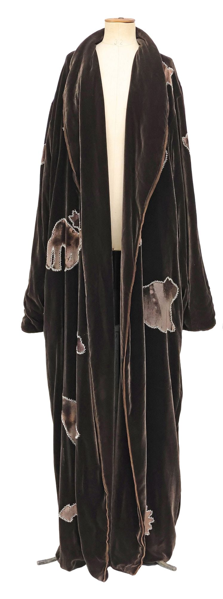WOMEN'S WESTERN STYLE VELVET PICTOGRAPHIC DUSTER COAT: Women's western style velvet duster coat, leather tag marked "Women of the Wild West, 1994, Pate Stetson Design," with applied patches depicting animals and pictographic motifs, sho