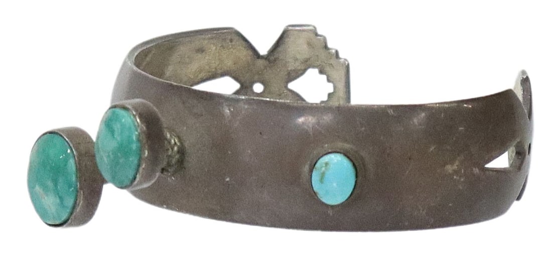 NATIVE AMERICAN STERLING & TURQUOISE CABOCHON CUFF: Native American sterling silver cuff bracelet, stamped IW (?), with elevated bezel-set turquoise cabochons, shaped and pierced ends, approx 0.75"w, interior: approx 5 7/8"l, gap: approx 1 3/