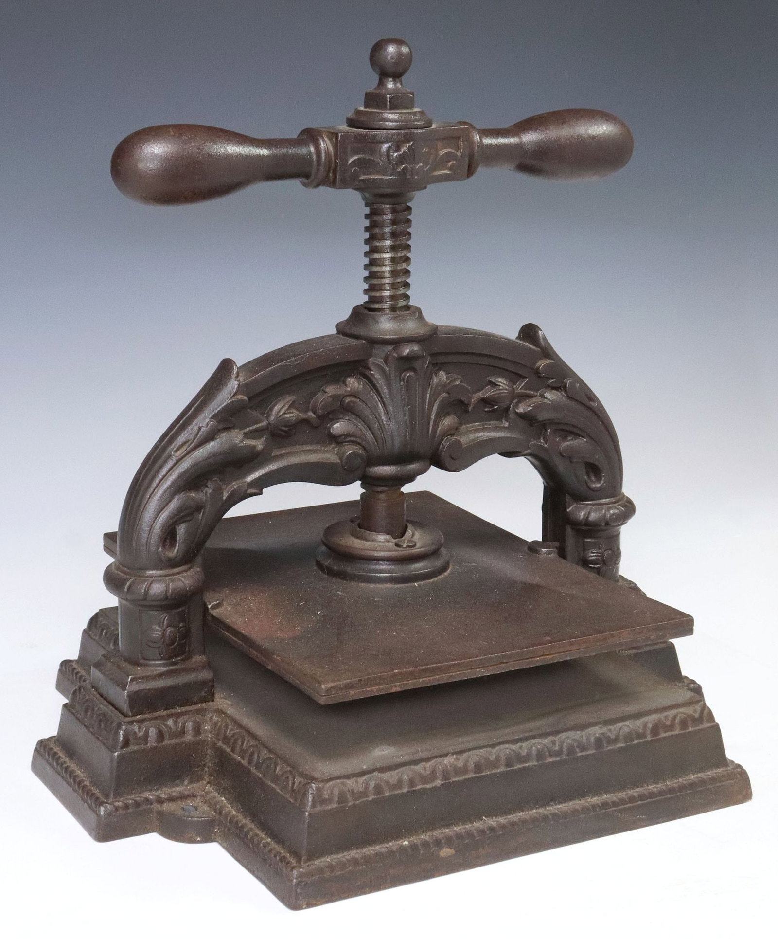 CAST IRON PAPER OR BOOK NIPPING PRESS: Cast iron paper or book nipping press, opening height (daylight): approx 1 7/8"h, plate surface: approx 11"l, 9"w, overall: approx 17"h, 15"w, 12.5"d, 56lbs