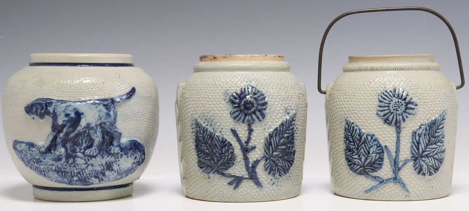 (3) SALT-GLAZED COBALT & WHITE STONEWARE JAR & CROCKS: (lot of 3) Salt glaze stoneware vessels, attributed to White's Utica Pottery, apparently unmarked, each with raised cobalt blue-glazed decoration on textured off-white ground, all lacking lids, in