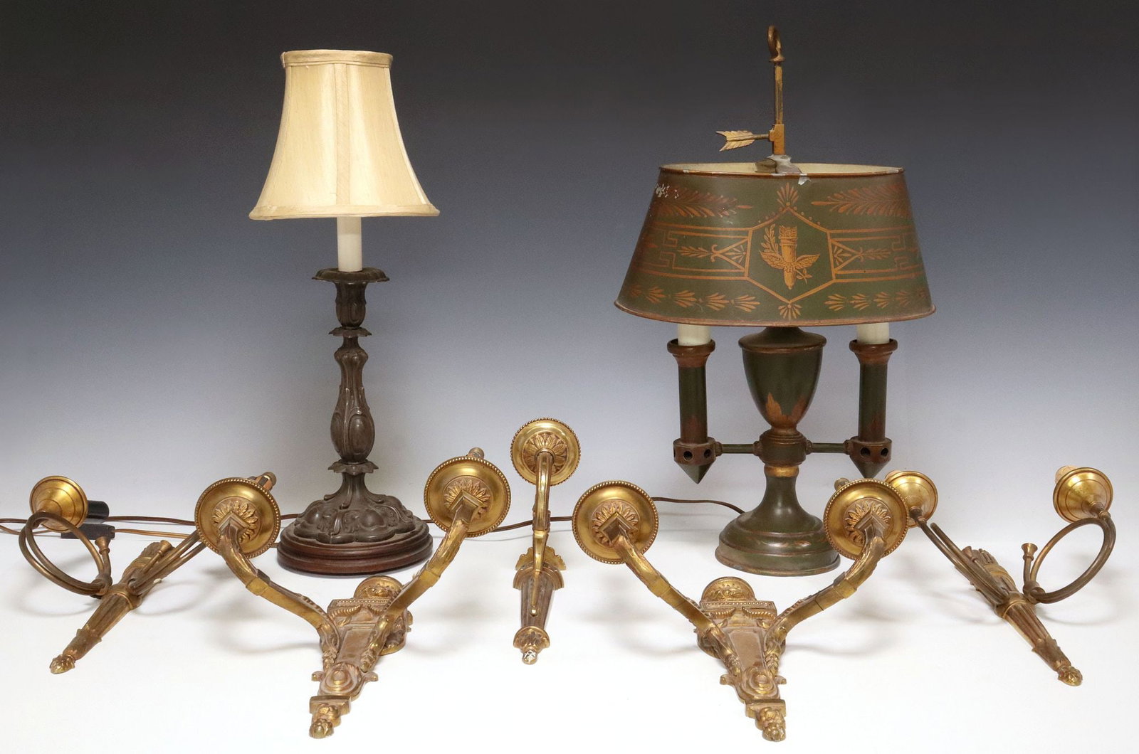 (7) FRENCH GILT METAL WALL SCONCES & TABLE LAMPS: (lot of 7) Collection of French lighting, 20th c., all sconces in need of wiring, including: (4) Louis XVI style gilt metal two-light wall sconces, (two) having urn finial over tapered body, issuing t