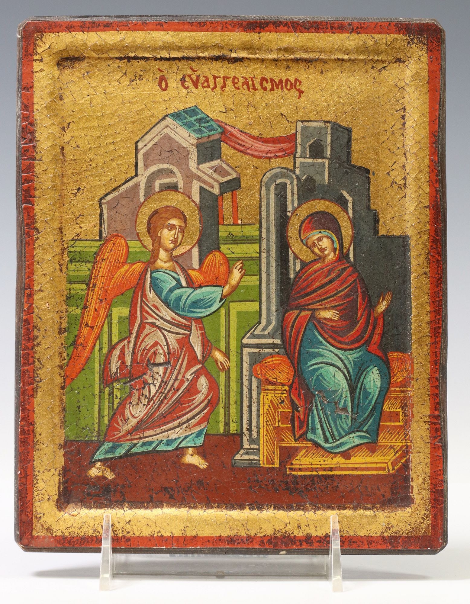 GREEK ORTHODOX PARCEL GILT & PAINTED ICON ON PANEL, THE ANNUNCIATION: Greek Orthodox parcel gilt and mixed media icon on wood panel, "The Annunciation," titled in Greek script upper center, approx 9"h, 7 1/8"w, 1.25lbs