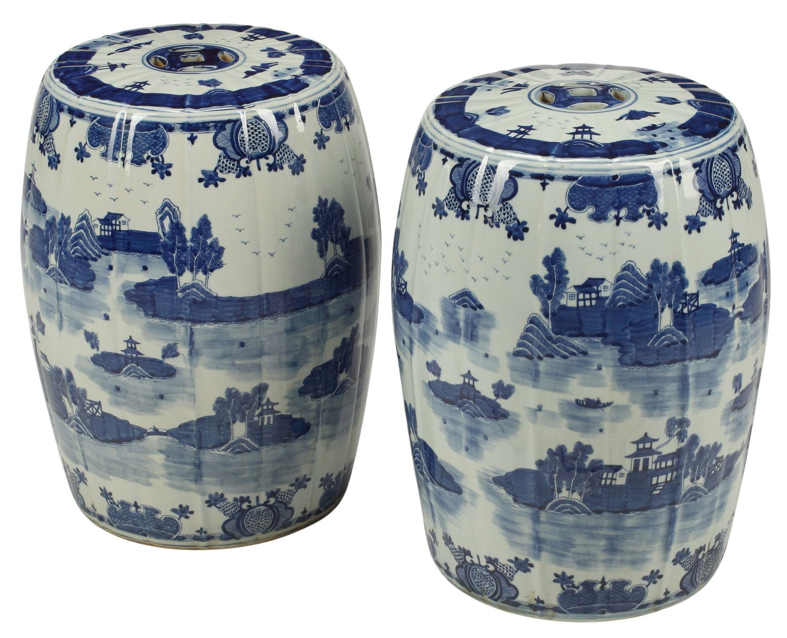 (2) CHINESE BLUE & WHITE PORCELAIN FLUTED GARDEN SEATS: (pair) Chinese blue and white porcelain fluted garden seats, with architectural motifs in wooded landscapes, approx 19"h, 13.5"diam, 47lbs total