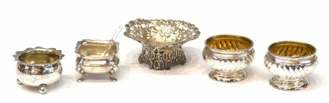 (5) ANTIQUE ENGLISH STERLING SALT DISHES: (lot of 4) Collection of antique sterling silver salts, comprising: (1) Carrington & Company, London, c. 1893, pierced heart form dish, marked 'JBC' in a quatrefoil, 1.5"h. 3.25"w, 3.5"d; (2) John Sep