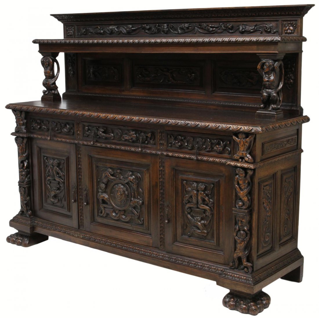 HIGHLY CARVED SPANISH RENAISSANCE REVIVAL SERVER: Large Spanish Renaissance Revival two part server, Northern Spain,19th c., profusely carved with grotesque figures, griffins, masks and foliage, a stepped cornice over the carved back with display she