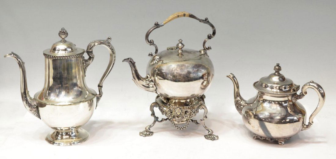 (3)SILVERPLATE TEAPOTS, ONE TILTING ON FANCY STAND: (lot of 3) Silver plate tea pots: (1) tilting hallmarked WH & Co S (William Howe & Co., Sheffield) set on ornate stand with burner, damaged wicker at handle, 11.25"h, 9"w, 7.25"d; (1) Poole Silver Com