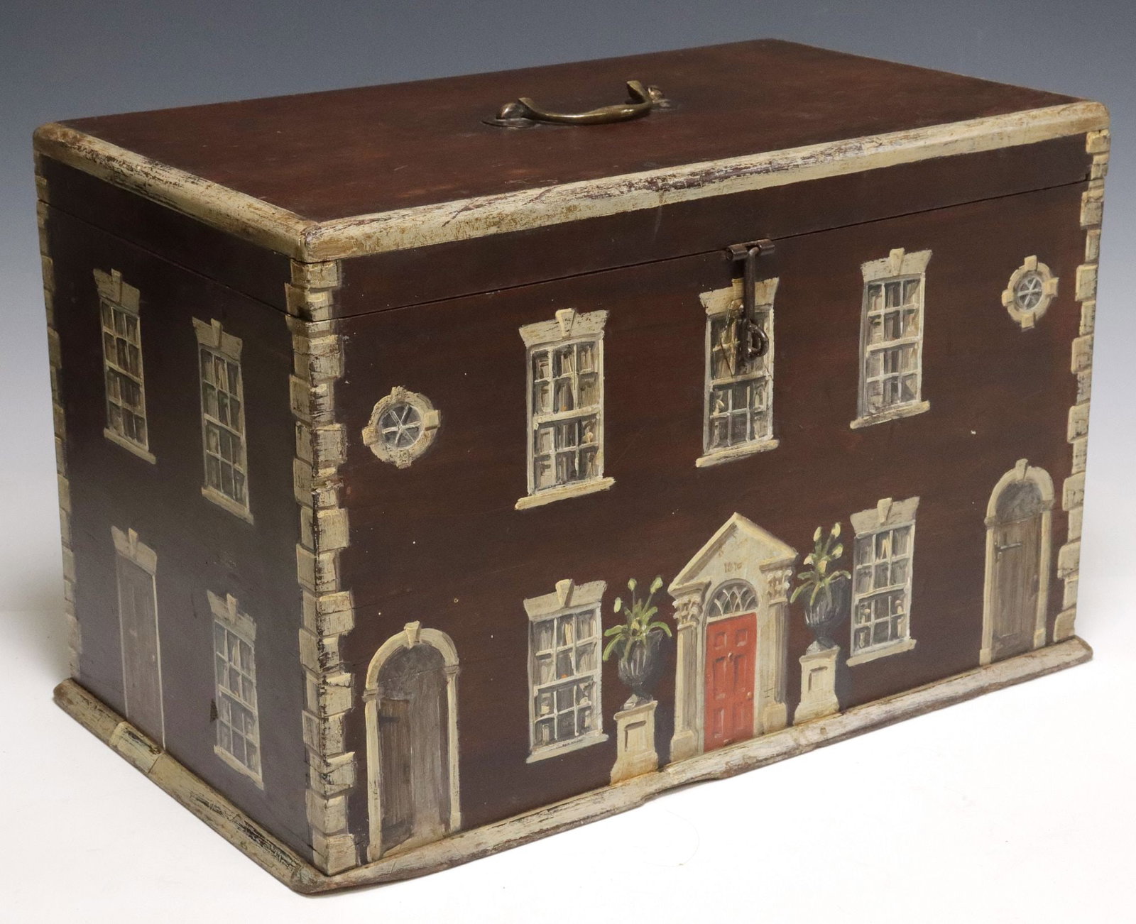 ENGLISH PAINT-DECORATED HOUSE FACADE WORK BOX: English paint-decorated pine work box, early 20th c., exterior with later paint-decoration as a Georgian house facade, hinged lid with central metal handle, revealing open storage, approx 13"