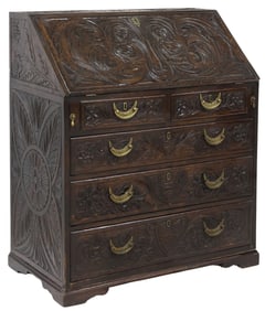 BRITISH HEAVILY CARVED OAK SLANT-FRONT BUREAU