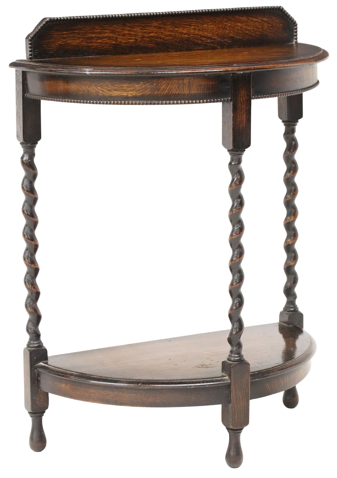 ENGLISH CARVED OAK BARLEY TWIST DEMILUNE CONSOLE TABLE: English carved oak demilune side table, 20th c., having shaped top with beaded trim, rising on barley twist supports, joined by medial shelf, ending on rounded feet, approx 31.75"h, 24"w, 12.5"d