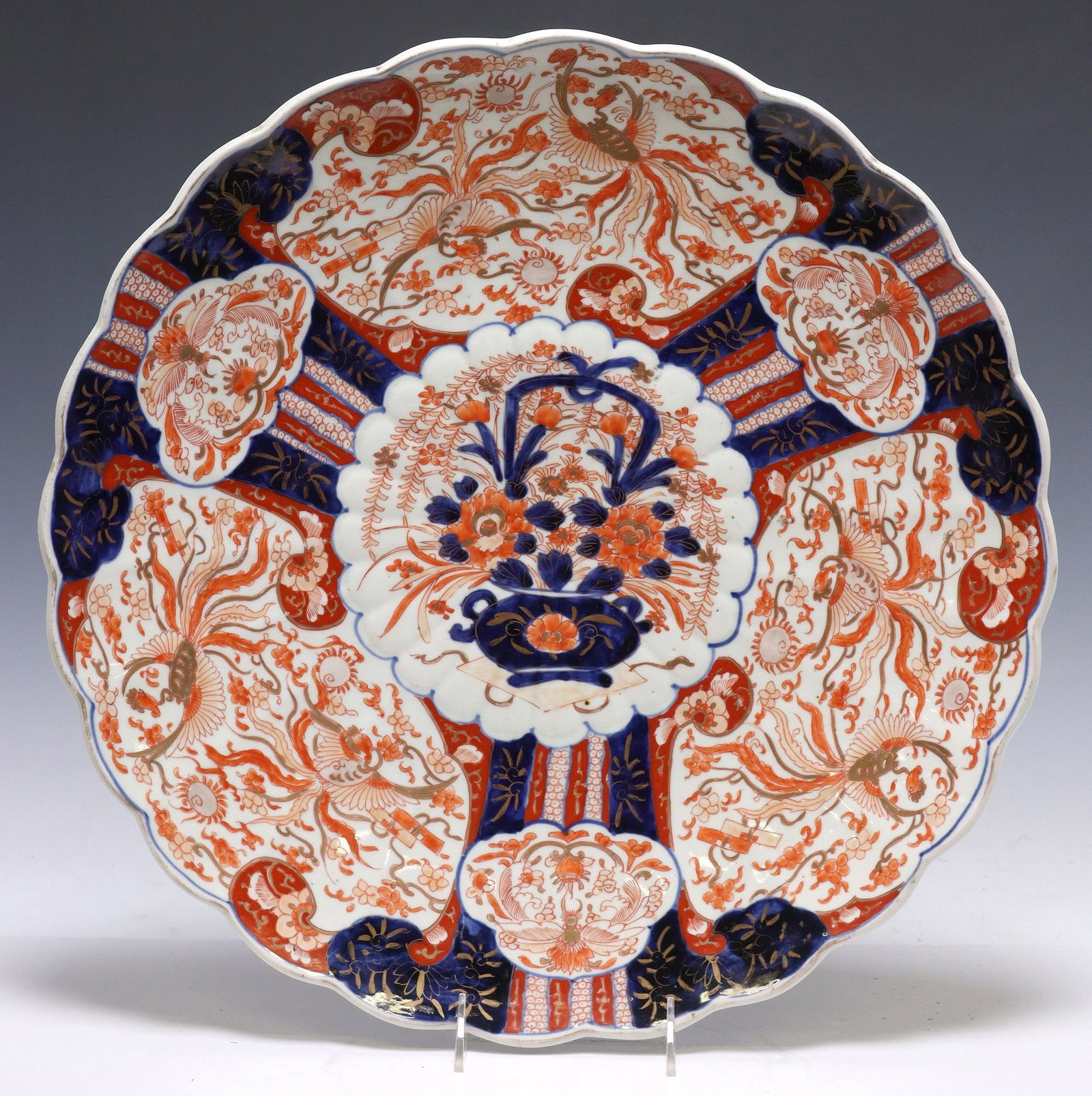 LARGE JAPANESE IMARI PALETTE PORCELAIN CHARGER, 18"DIAM: Large Japanese parcel gilt porcelain charger, in the Imari palette, having scalloped border, with central floral urn, among phoenix and scrolled foliate motifs, approx 18"diam, 7.75lbs