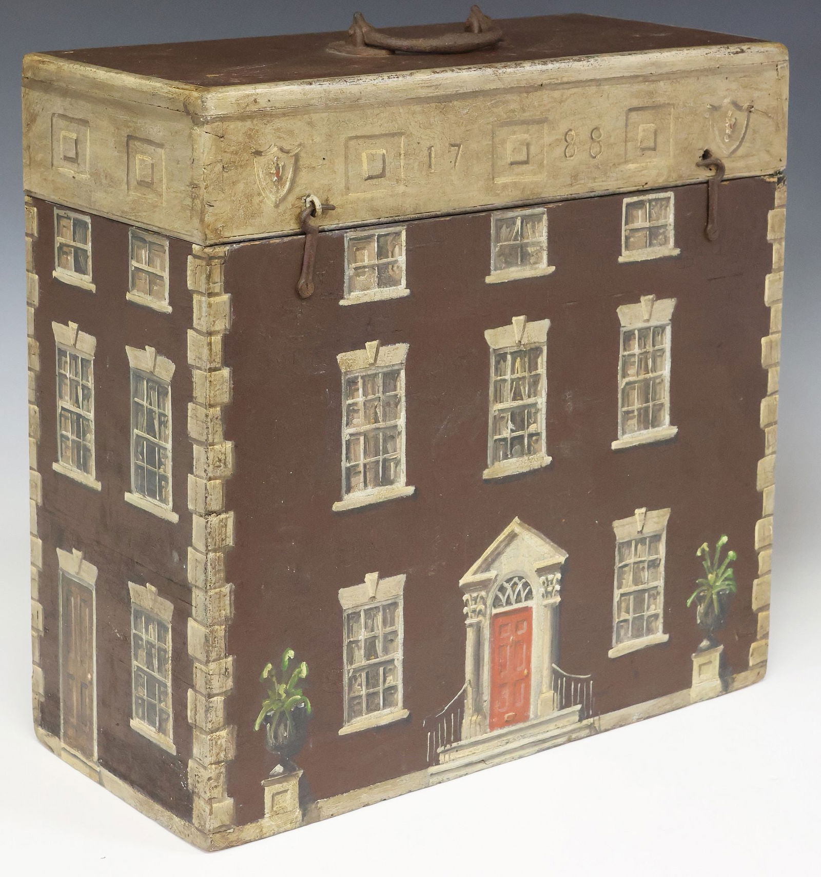 ENGLISH PAINT-DECORATED HOUSE FACADE WORK BOX: English paint-decorated work box, late 19th c., exterior with later paint decoration as a Georgian house facade, hinged lid with central iron handle, revealing open storage interior, approx 17.25