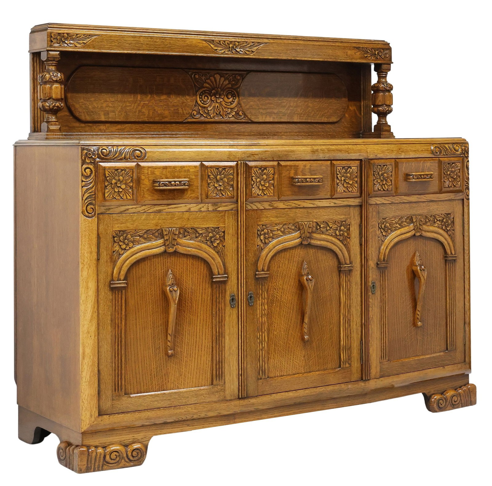 JACOBEAN STYLE CARVED OAK BUFFET / SERVER: Jacobean style carved oak buffet/ server, c.1930s, having raised shelf on bulbous turned supports, lower case fitted with three drawers, central drawer revealing sectioned interior, over three cabinet