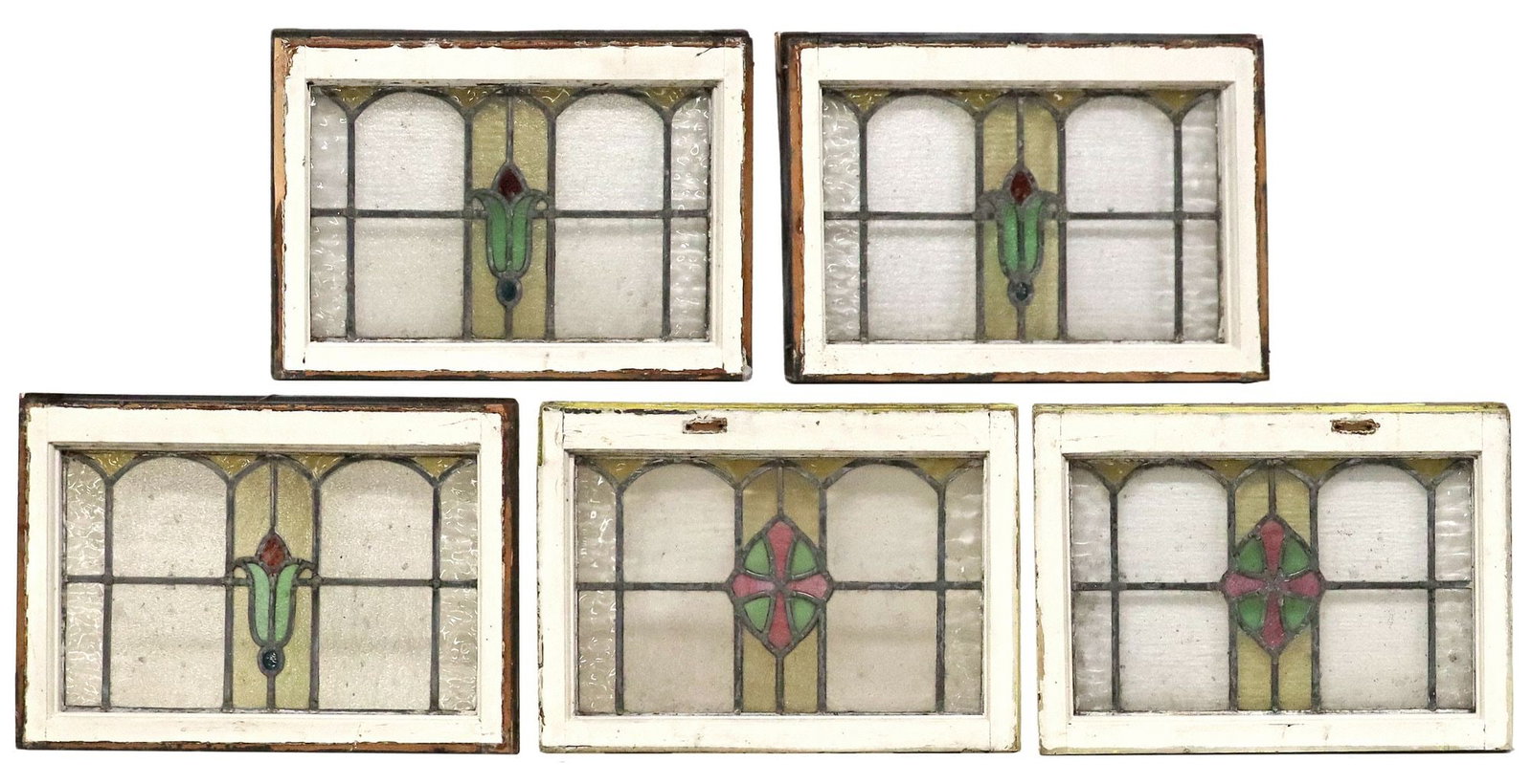 (5) ENGLISH STAINED & LEADED GLASS ARCHITECTURAL WINDOWS: (lot of 5) English architectural stained and leaded glass windows, early 20th c., worn white painted wood frames, encasing clear and polychrome textured glass panels, of varied foliate and geometric d