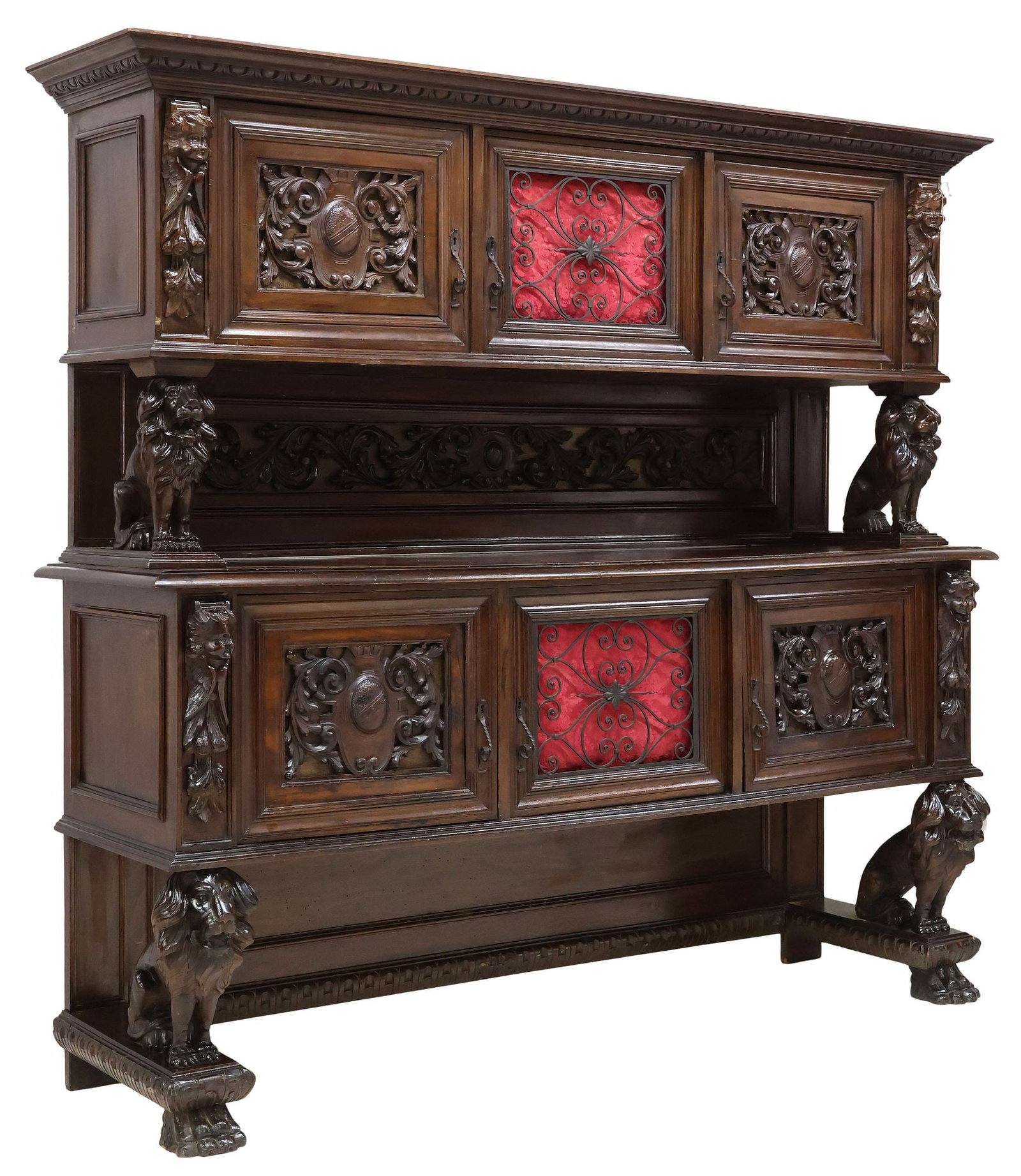ITALIAN RENAISSANCE REVIVAL CARVED WALNUT LIONS SIDEBOARD: Italian Renaissance Revival carved walnut sideboard, early 20th c., stepped cornice with egg-and-dart molding, each case fitted with three cabinet doors, the center door with a wrought iron grille, su
