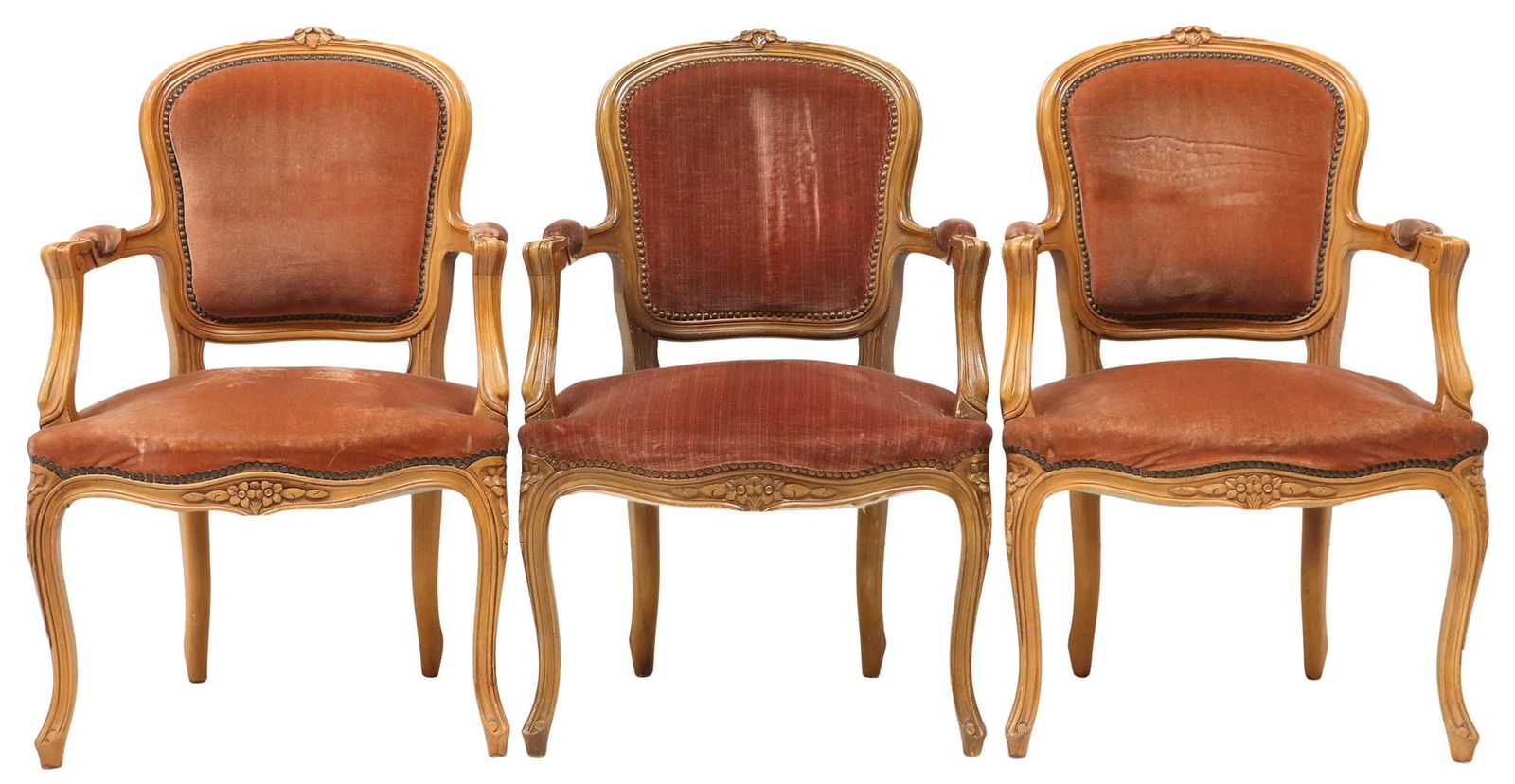 (3) FRENCH LOUIS XV STYLE PINK VELVET UPHOLSTERED ARMCHAIRS: (lot of 3) French Louis XV style carved wood fauteuils/ armchairs, 20th c., each having floral crest, over padded back, seat, and arms in pink velvet upholstery, with nailhead trim, rising on cabriole