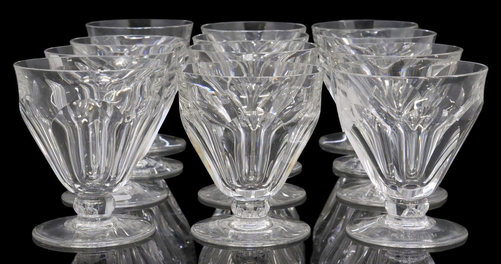 (12) BACCARAT 'TALLYRAND' CUT CRYSTAL WHITE WINE STEM GLASSES: (lot of 12) French Baccarat cut crystal white wine stems, in the "Tallyrand" pattern, each with paneled bowl, on circular foot, acid-etched maker's mark underfoot, one with minute fleabi