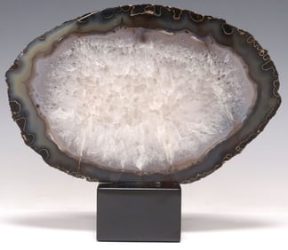 GEOLOGICAL OVULAR AGATE SLICE ON BLACK MARBLE BASE