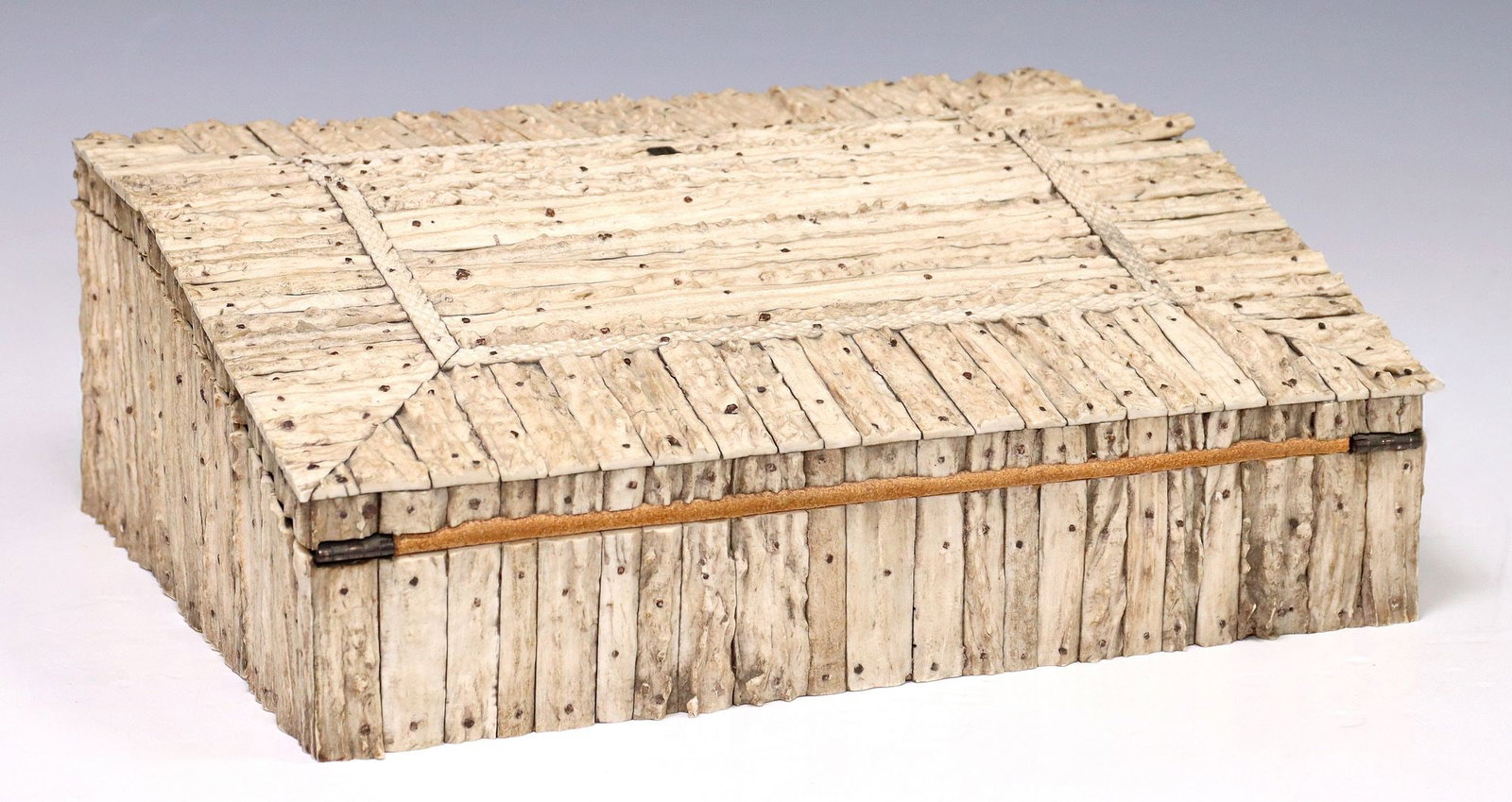 ANGLO-INDIAN STAG ANTLER & HORN-VENEERED WRITING SLOPE: Anglo-Indian sloped writing desk, 19th c., the exterior completely clad with sections of deer antler, hinged slant-front panel enclosing an inset leather writing surface, interior compartment with sma