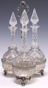 VICTORIAN SILVERPLATE STAND & THREE CUT-GLASS DECANTERS