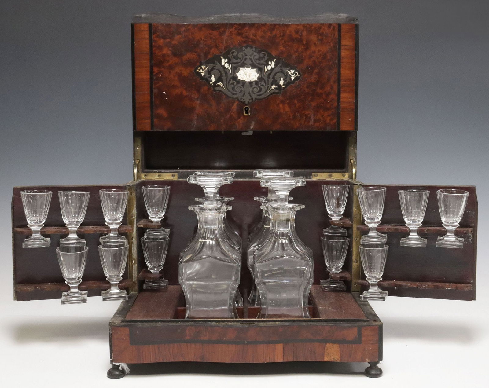 FRENCH NAPOLEON III PERIOD INLAID BURLWOOD CAVE A LIQUEUR: French Napoleon III period marquetry liqueur casket, 19th c., hinged case finished in amboyna burlwood veneers, with parcel-ebonized parquetry trim, and scrolled foliate cut-brass marquetry with