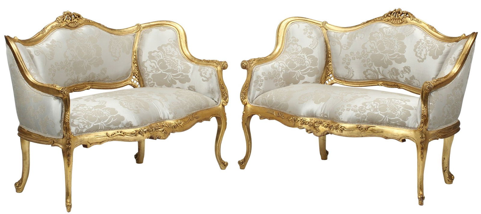 (2) LOUIS XV STYLE UPHOLSTERED GILT SALON SOFAS: (pair) Louis XV style gilt salon settees, each having pierced floral crest, over padded back and seat in damask upholstery, with ribbon trim, rising on cabriole legs, ending on whorl feet, approx 35&q