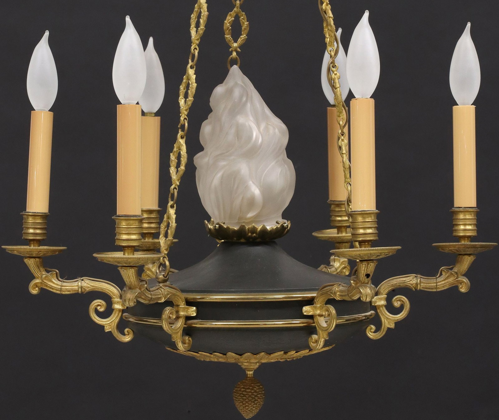 FRENCH EMPIRE STYLE TOLE-PEINTE SEVEN-LIGHT CHANDELIER: French Empire style gilt metal and tole painted seven-light chandelier, 20th c., gilt chainlink garland suspending circular tole body in a black-painted finish with brass trim, central molde