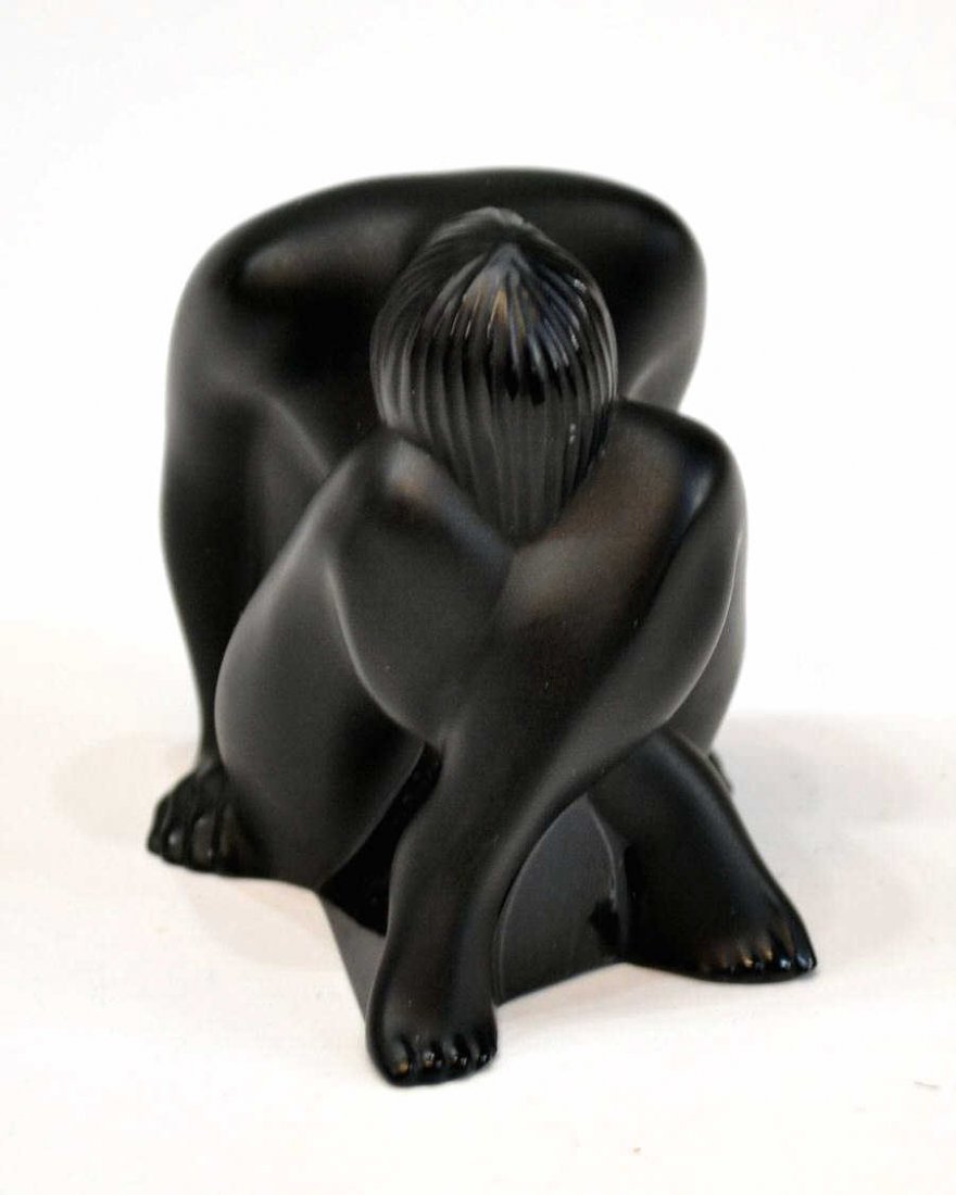 LALIQUE BLACK CRYSTAL NUDE VENUS FIGURE: Lalique black crystal figure, 'Nude Venus', depicting a seated woman kneeling into her knees, marked underfoot, 2.5"h, .25lbs Start Price: $150.00