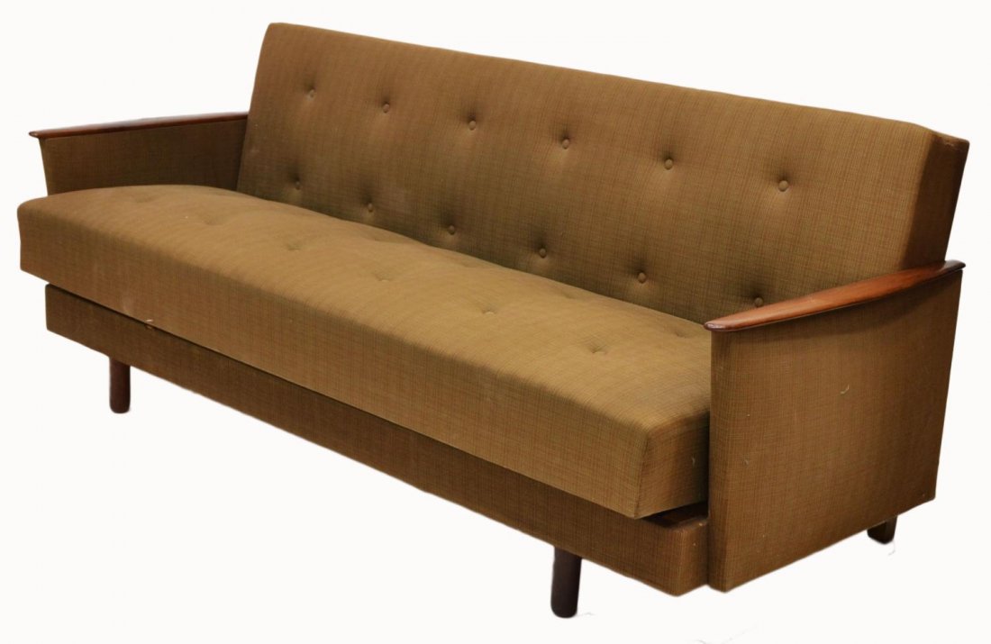 DANISH MID-CENTURY MODERN TEAKWOOD SOFA BED: Danish mid-century modern sofa converting to a bed, teak wood arms flanking the dark green buttoned upholstery with the hinged upper cushion folding down for use as a bed and the seat cushion sliding 