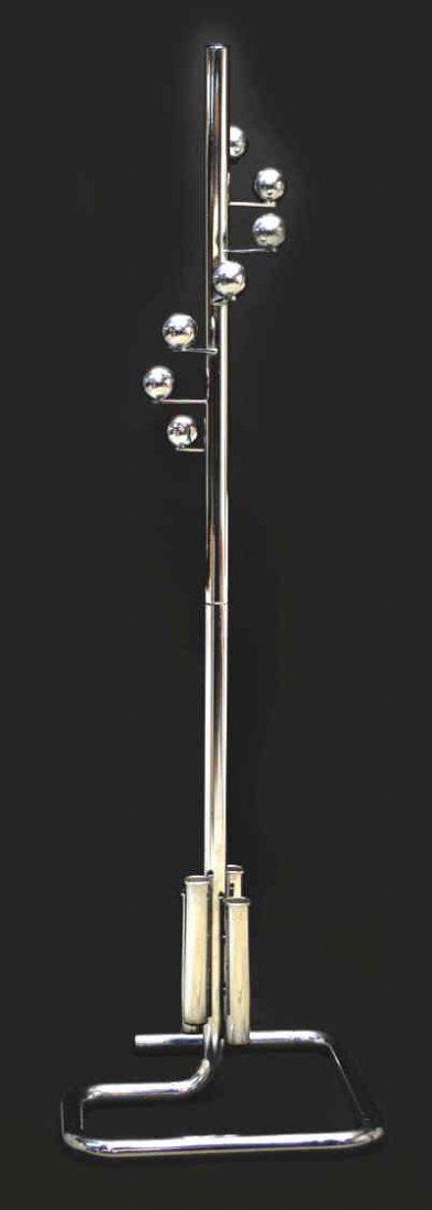 ITALIAN MODERN CHROMED STEEL ROTATING HALL TREE: Italian modern chromed steel hall tree, c. 1970, stepped ball form coat hooks on the central rotating shaft with four umbrella tubes mounted below, all rising on the open rectangular tube base, 69.5ö