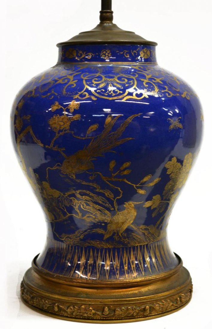 ANTIQUE CHINESE PARCEL GILT BLUE PORCELAIN VASE: Chinese parcel gilt porcelain vase of baluster form, possibly Kangxi period, now as a lamp, the cobalt ground parcel gilt with border of scrolled tendrils amid peaches and bats, above blooming branche