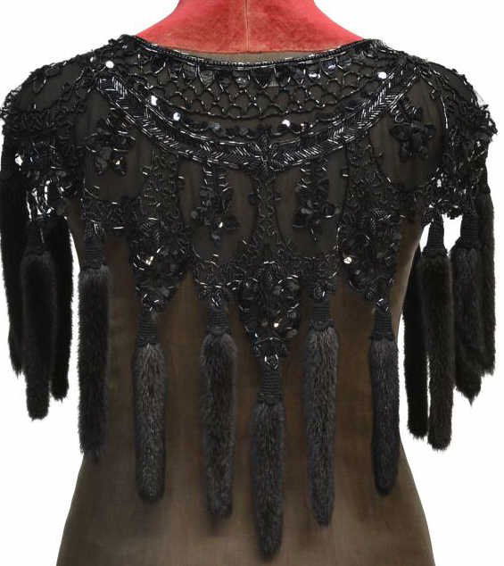 LADIES VINTAGE CANADIAN BEADED & MINK TASSEL WRAP: Ladies vintage Canadian black beaded and sequined wrap, floral motif, having mink tassel trim, retaining LF tag on interior, approx. 17"w (shoulder), 22"l, 1lb **Provenance: Estate of Vera Habrecht Si