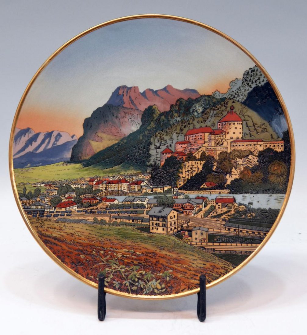 LARGE METTLACH SCENIC VIEW WALL PLAQUE / CHARGER: Mettlach Villeroy and Boch wall plaque, early 20th c., scenic mountainside view, gilded rim, marked verso, # 2760, 17.5"diam, 8.25lbs Start Price: $150.00