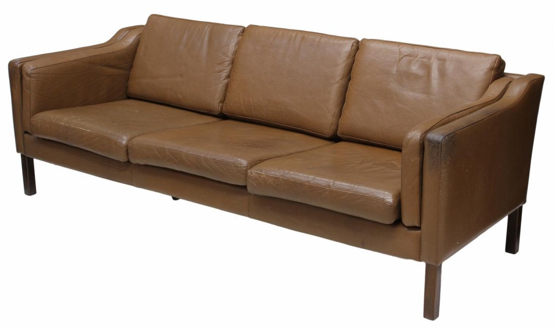 DANISH MID-CENTURY MODERN LEATHER SOFA: Danish mid-century modern leather upholstered sofa, six back and seat cushions with two side cushions, raised on black painted wood legs, 27öh, 78öl, 27.5öd Start Price: $200.00