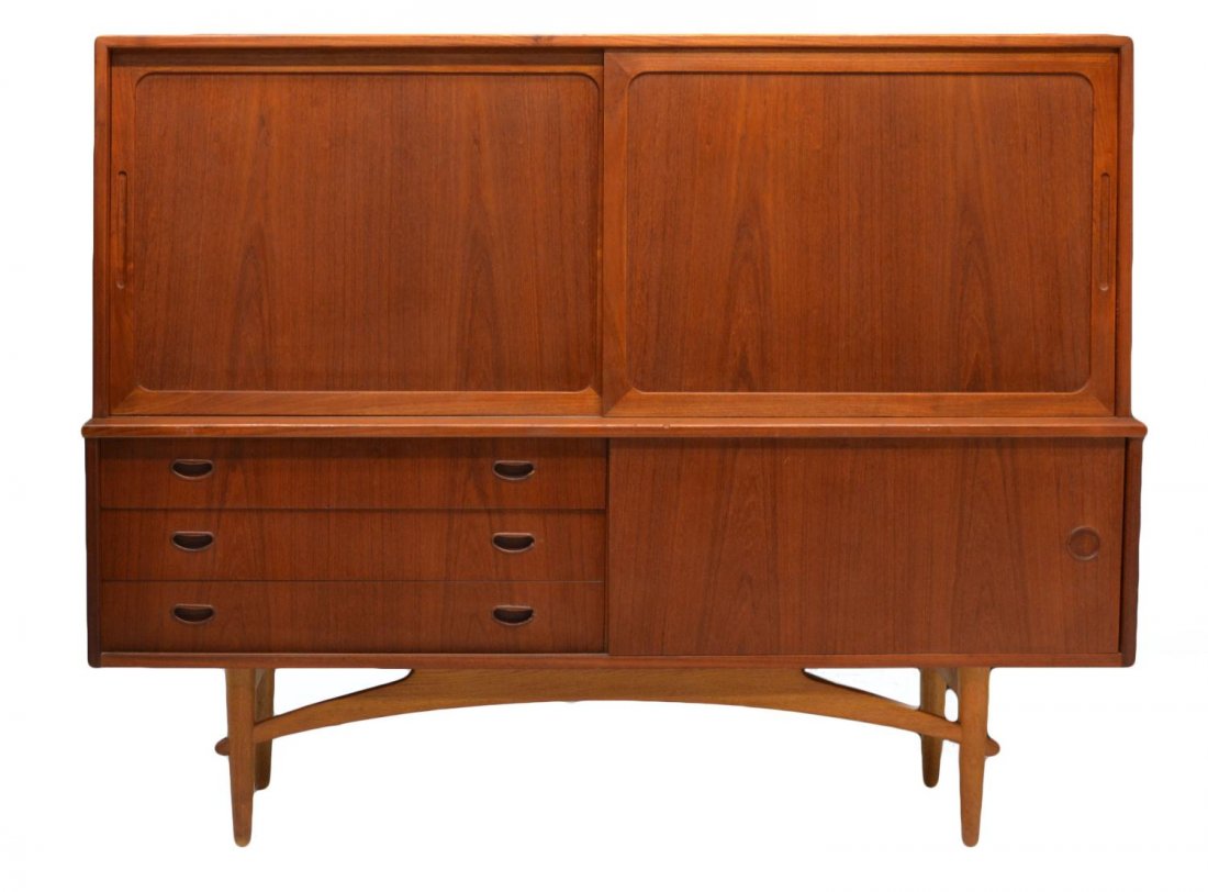 DANISH MID-CENTURY MODERN TEAKWOOD SIDEBOARD: Danish mid-century modern teakwood sideboard, two upper sliding doors opening to the birch wood interior with shelves and three drawers, the lower section with three drawers and a sliding door, some l