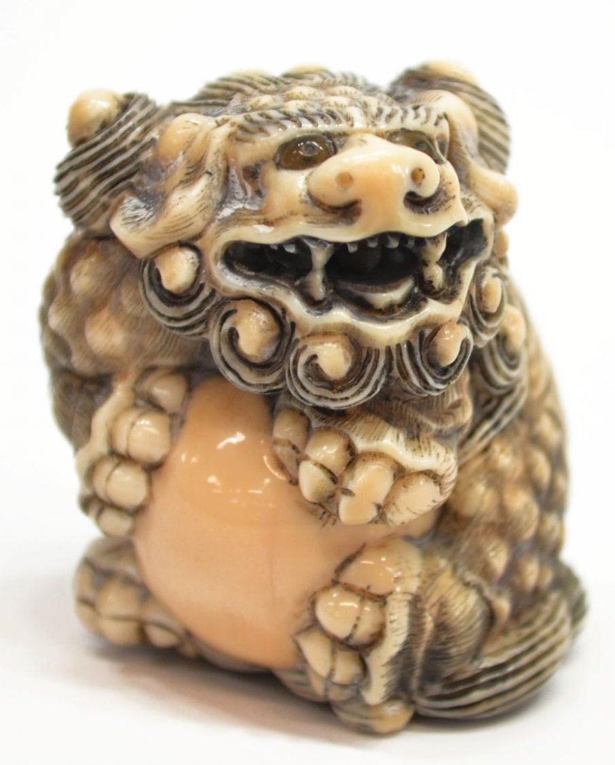 CHINESE CARVED IVORY LION FORM NETSUKE: **This lot will not be shipped Internationally**Chinese carved ivory netsuke in the form of a lion, approx. 1.5"h, 1.25"w, .25lbs Start Price: $40.00