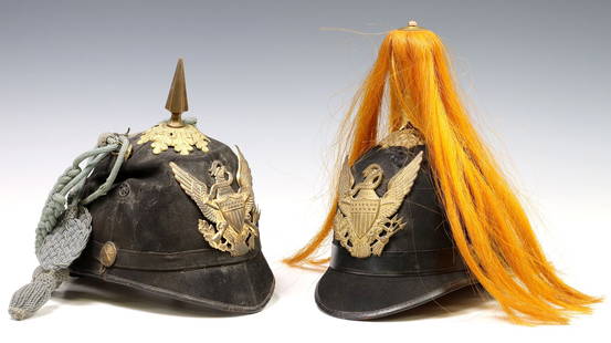 (2) U.S 1881 MILITARY HELMETS: .(lot of 2) U.S. Military Model 1881 Dress Helmets: (1) Cavalry Dress Helmet, black with reddish orange plume, the front with the large brass plate depicting the American eagle holding a E