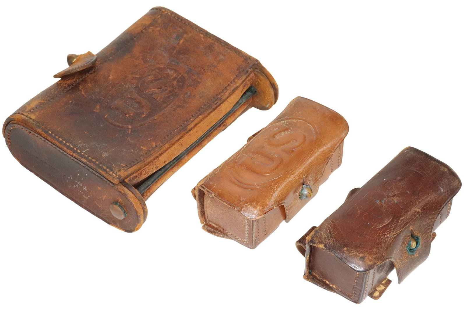 (3) TEXAS/U.S. CARTRIDGE BOX & 1896 REVOLVER CARTRIDGE BOXES: (lot of 3) Cartridge Boxes: (1) McKeever Texas/U.S. cartridge box in brown leather stamped "U.S." within an oval at front, the inner left end stamped "Rock Island Arsenal, 190